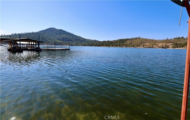 dock area with a water and mountain view