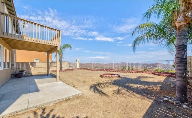 view of yard with a patio area and a fire pit