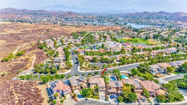 aerial view featuring a water and mountain view