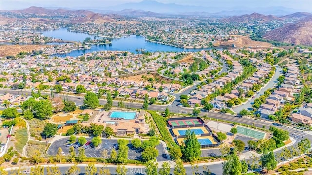 aerial view featuring a water and mountain view