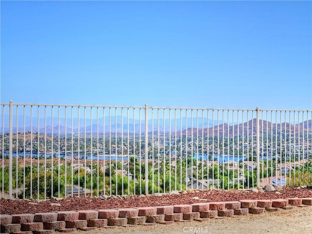 birds eye view of property featuring a water and mountain view