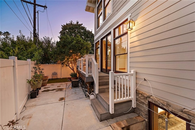 view of patio terrace at dusk