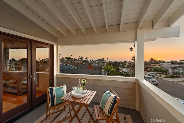 view of balcony at dusk