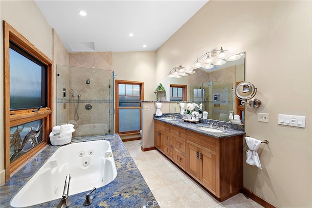 bathroom with separate shower and tub, tile patterned floors, and vanity