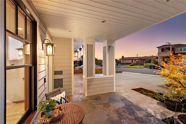 view of patio terrace at dusk