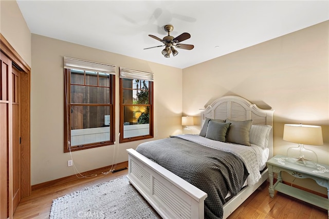 bedroom with light wood-type flooring and ceiling fan