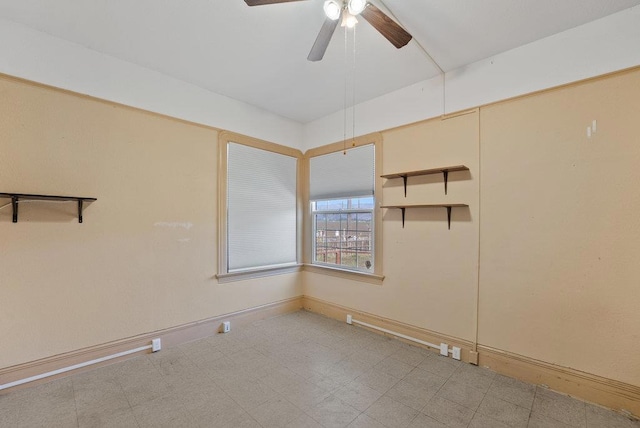 empty room featuring ceiling fan