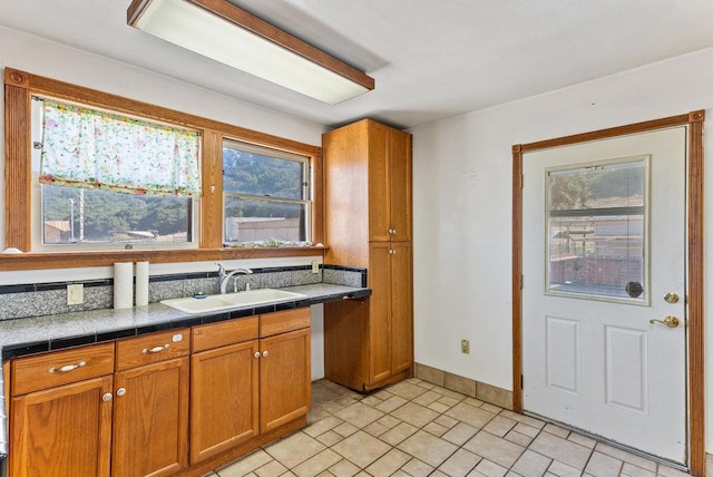 kitchen with sink and tile countertops