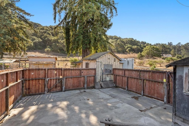 view of patio with a storage unit