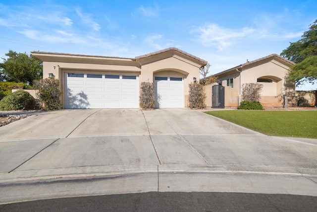 view of front of home with a garage and a front yard