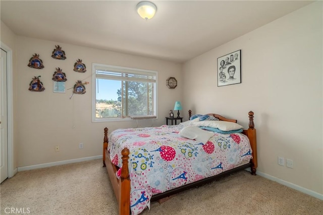 bedroom featuring light colored carpet