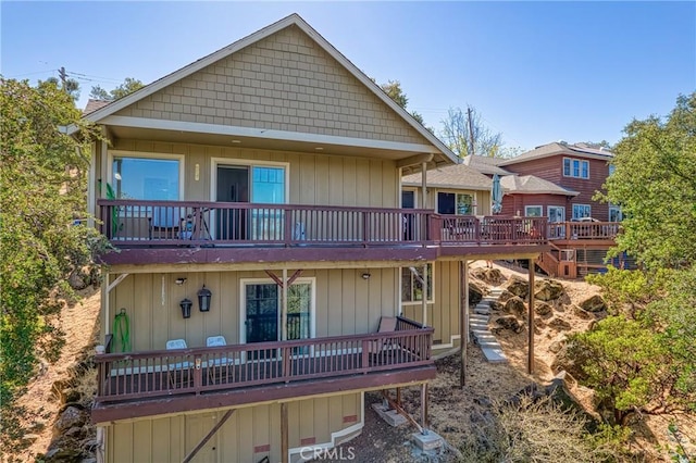 rear view of property featuring a deck