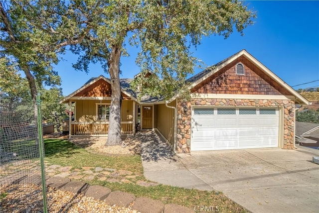 view of front facade featuring covered porch and a garage