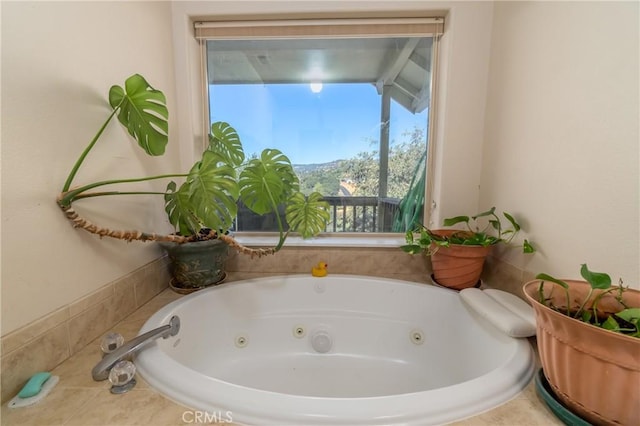 bathroom featuring tiled bath