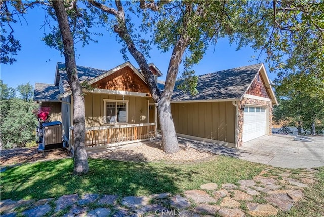 view of front of house featuring covered porch and a garage