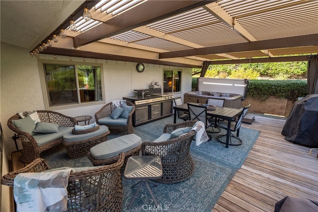 wooden terrace featuring area for grilling and a pergola