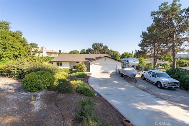 ranch-style house featuring a garage