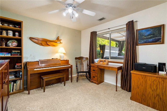 office with light carpet and ceiling fan