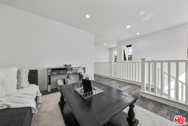 living room with dark wood-type flooring