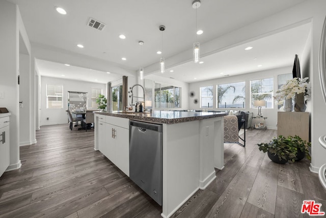 kitchen featuring an island with sink, white cabinetry, dark hardwood / wood-style floors, and dishwasher