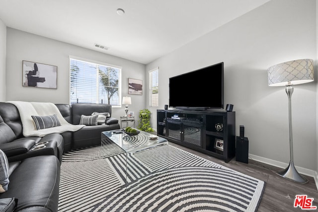 living room featuring dark hardwood / wood-style flooring