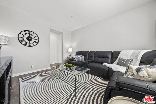 living room with dark hardwood / wood-style floors