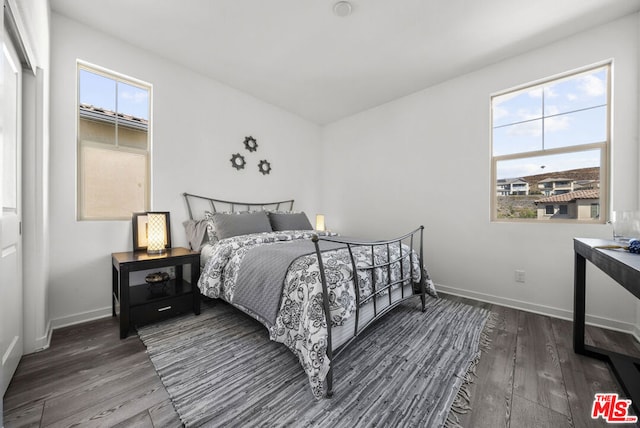 bedroom featuring dark hardwood / wood-style floors