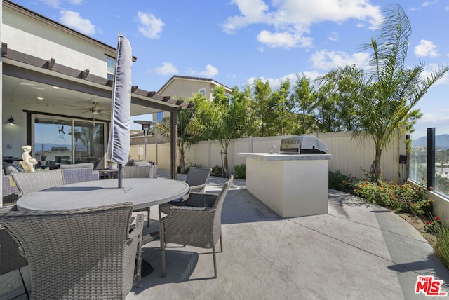 view of patio featuring ceiling fan and area for grilling