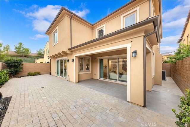 back of house featuring a patio area