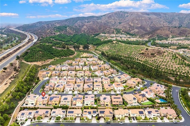 birds eye view of property featuring a mountain view