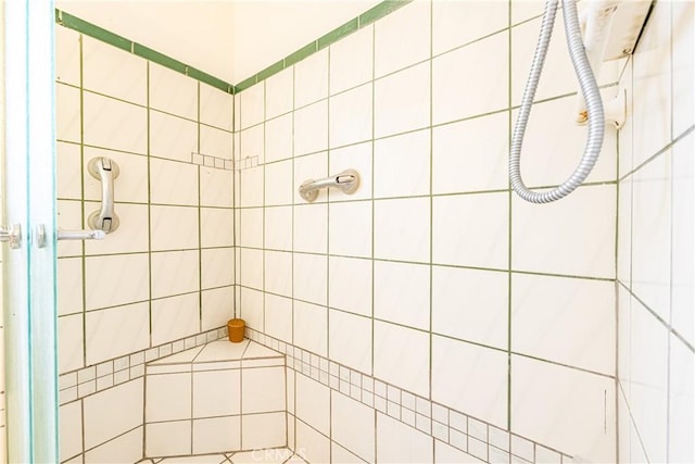 bathroom with tiled shower