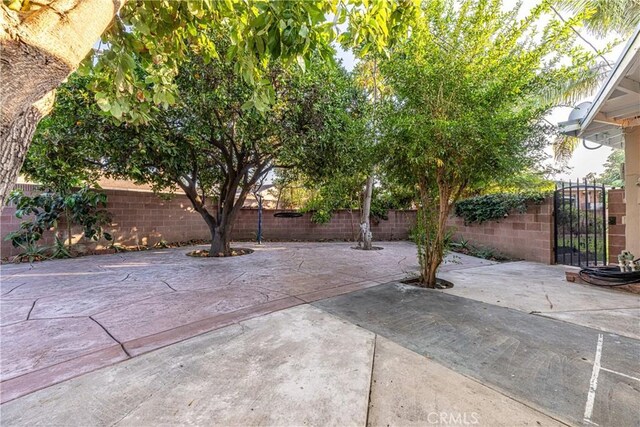 12124 Anderberg Ave, Downey, CA 90242 - fenced backyard with a patio area and a gate