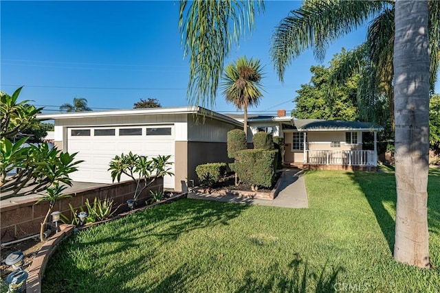 view of front of home featuring a garage and a front lawn