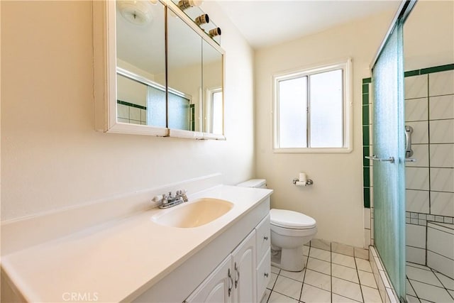 bathroom with tile patterned floors, toilet, an enclosed shower, and vanity