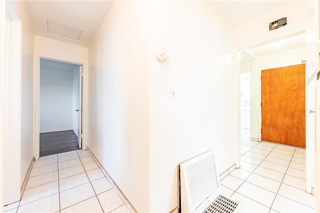 12124 Anderberg Ave, Downey, CA 90242 - hallway featuring light tile patterned floors and attic access
