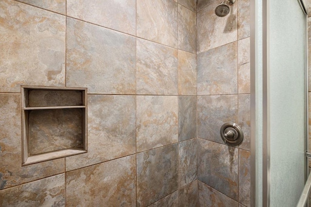 details featuring a tile shower