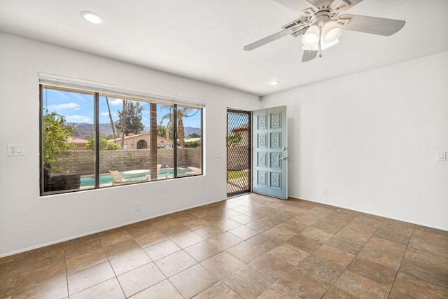 spare room featuring ceiling fan