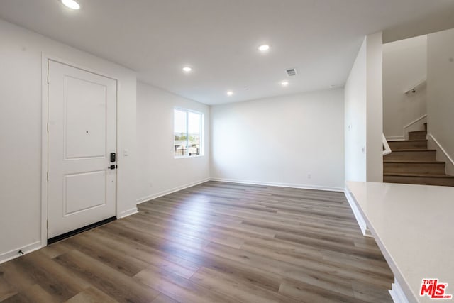 interior space with hardwood / wood-style floors