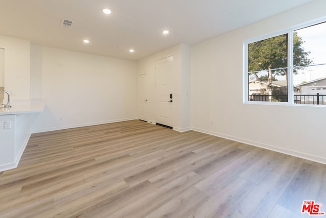 unfurnished room featuring light hardwood / wood-style flooring