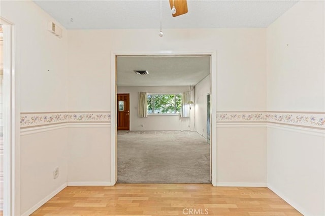 corridor featuring hardwood / wood-style flooring