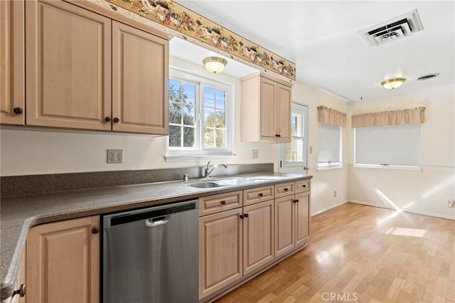 kitchen featuring sink, stainless steel dishwasher, light brown cabinets, and light hardwood / wood-style floors