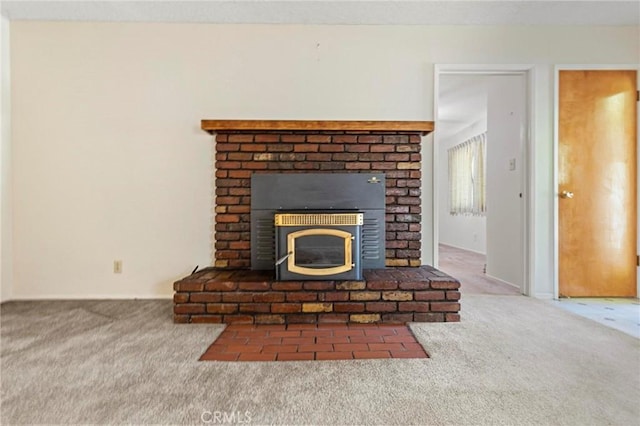 details with a fireplace and carpet