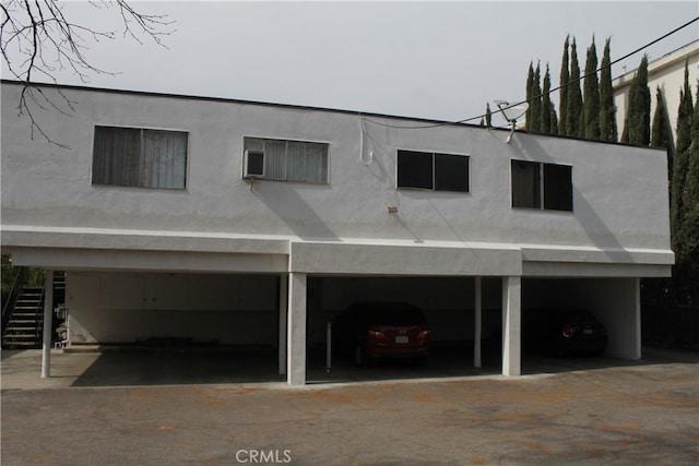 exterior space with a garage and a carport