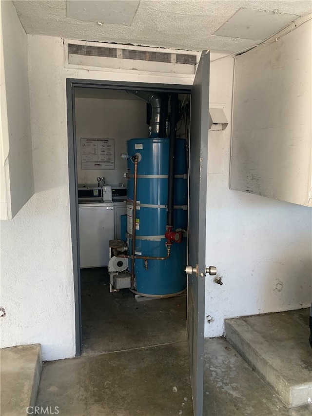 utility room featuring water heater