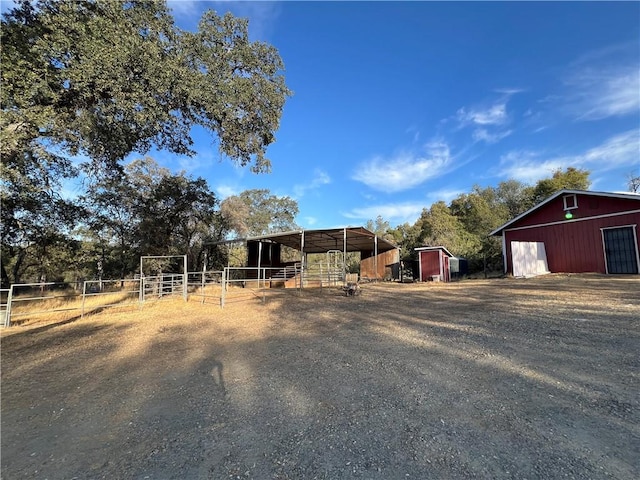 exterior space with a rural view and an outdoor structure