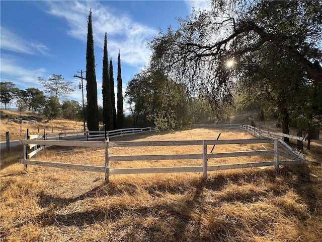 view of yard with a rural view