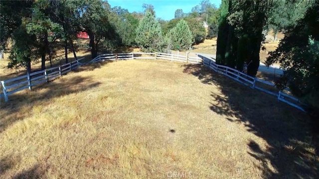 view of yard with a rural view