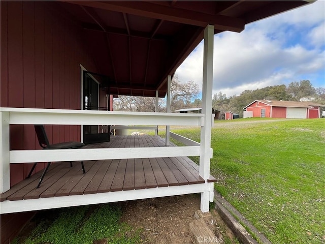 wooden deck with a yard