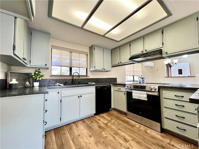 kitchen with a healthy amount of sunlight, light wood-type flooring, dishwasher, a chandelier, and stainless steel stove