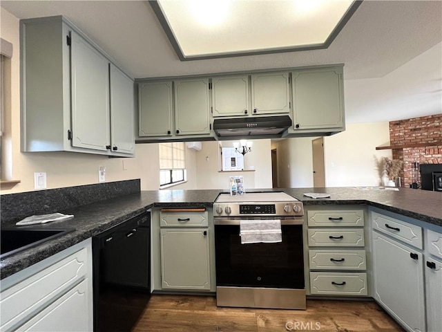 kitchen with dark wood-type flooring, kitchen peninsula, black dishwasher, and stainless steel electric range oven